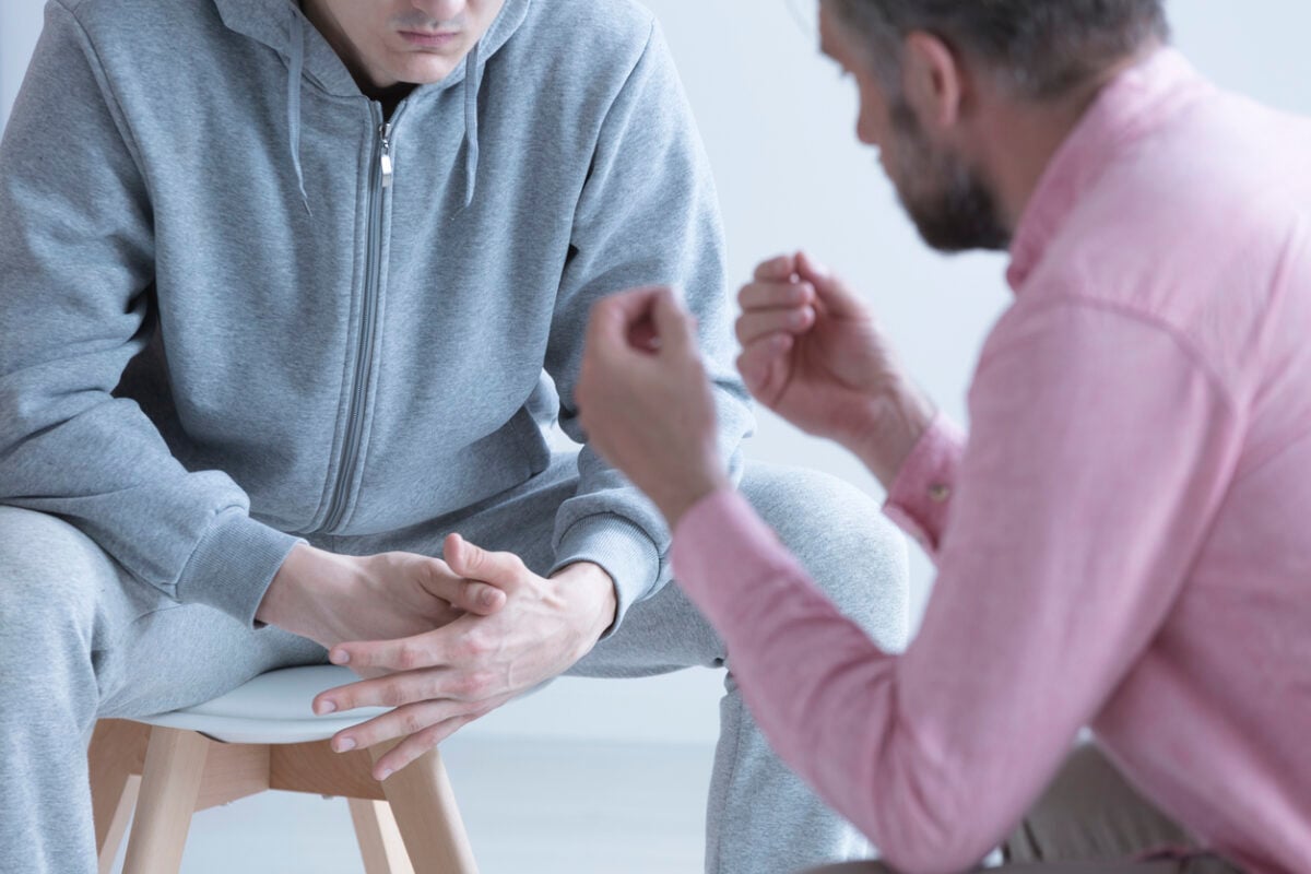 Mental health professional working with teenager on emotional regulation skills
