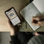 Person listening to Sober Speak recovery podcast on headphones