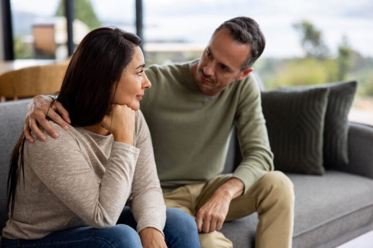 A parent and adult child hugging as trust returns after a relapse in recovery